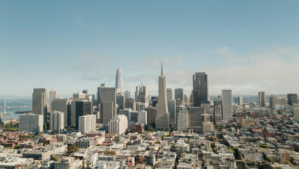 Modern city skyline with tall buildings under clear sky