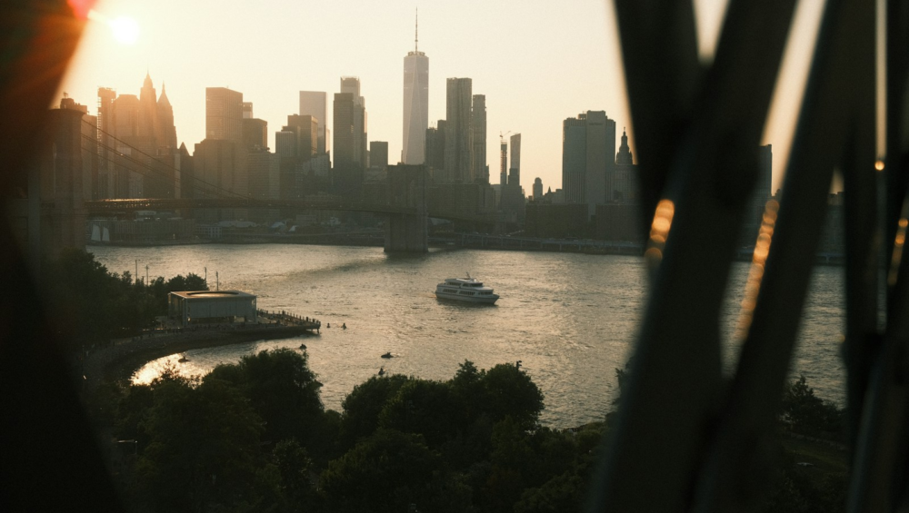 New york city skyline seen across the water at sunset.