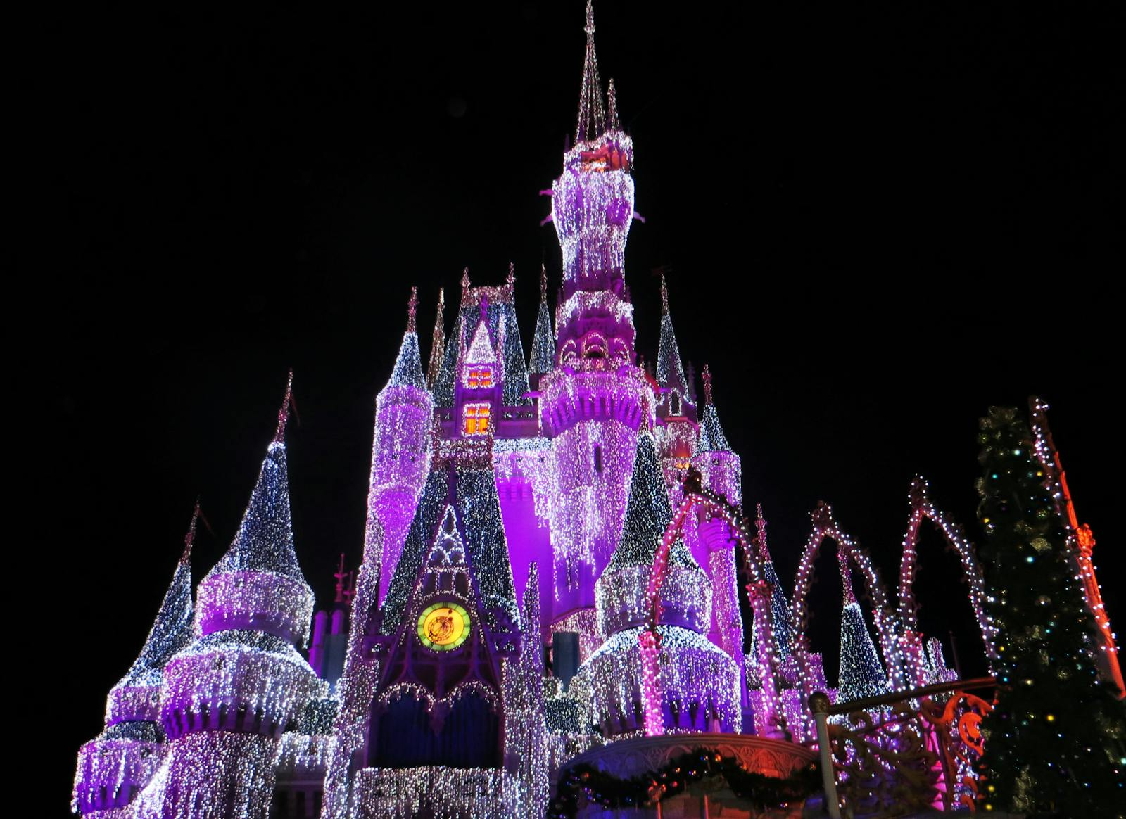 Magical illuminated castle glowing vividly at night, perfect for tourism and architecture themes.